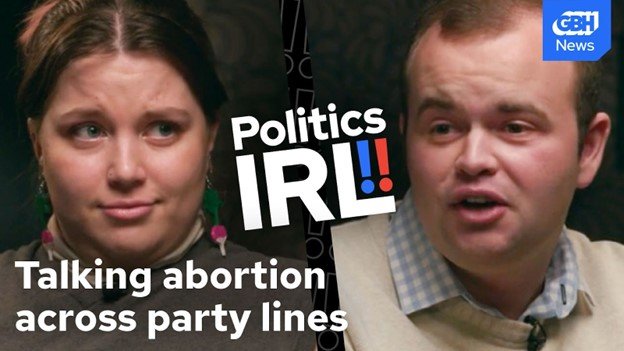A divided screen shows a woman on the left and a man on the right. Overprinted on the photos it reads: "Politics IRL!!" and "Taking abortion across party lines."